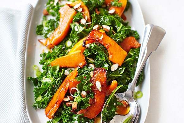Kale salad with roasted butternut squash, pomegranate molasses and almonds