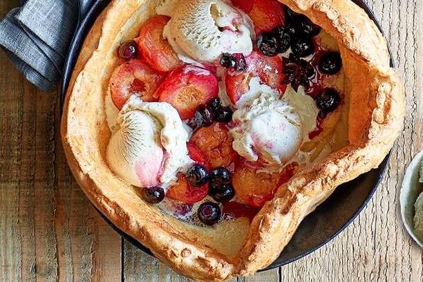 Dutch baby with spiced plums