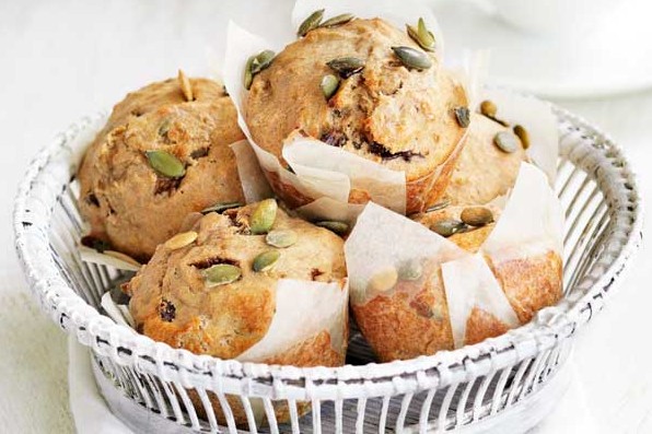 Banana and pumpkin seed muffins in a basket