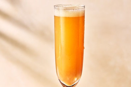 Bellini cocktail in a tall glass