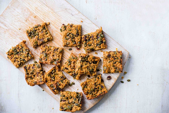 Healthy Flapjacks with Seeds on a Wooden Board