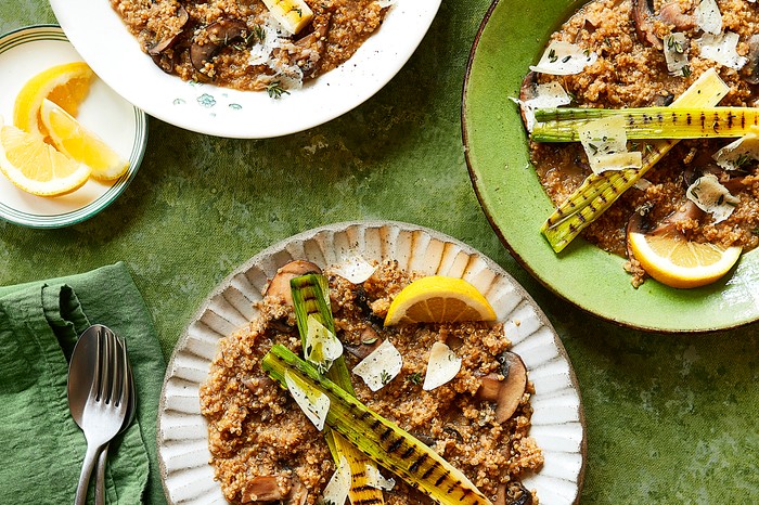 A quinoa risotto topped with charred leeks