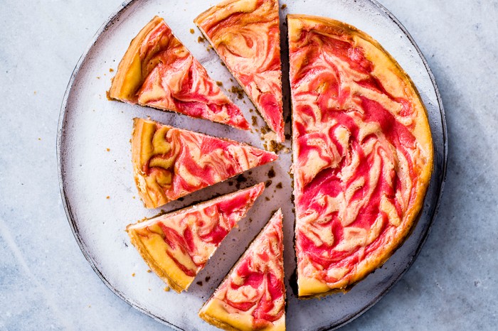 Baked Cheesecake with Rhubarb and Custard cut into slices