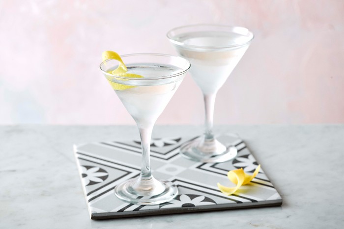 Two martini glasses on a tile